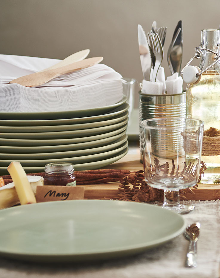Plates placed on the table to be used for dinner.