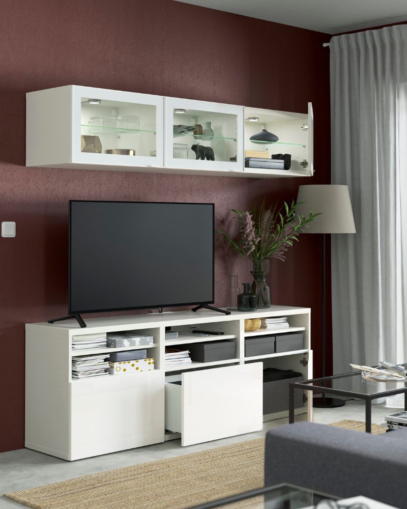Contemporary living room with BESTÅ TV storage, VITTSJÖ nesting tables, LÄTTBETONG rug, KONSTFULL vase and ROSENROBINIA curtains