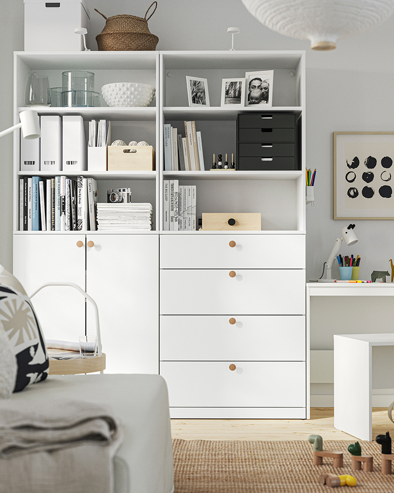 LASTARE wardrobe combination in white with open doors showing storage boxes inside.