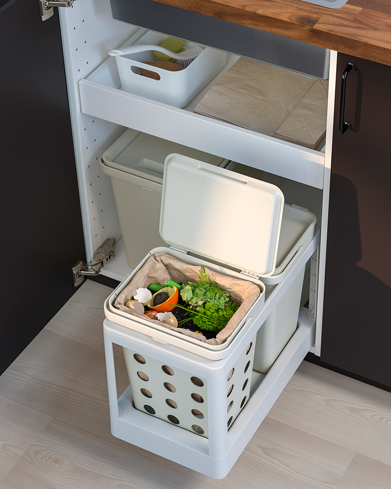 A HÅLLBAR  pull-out frame with several recycling bins with lid inside a kitchen drawer.
