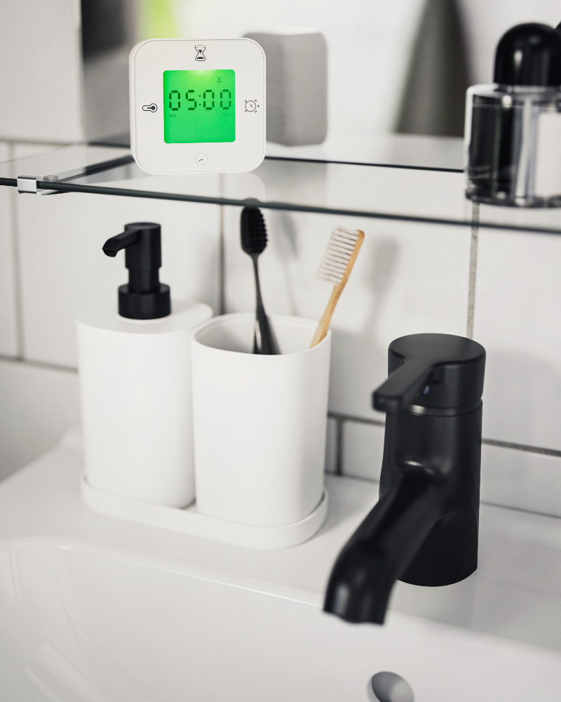 Modern black bathroom faucet SALJEN  with elegant design and coordinated white accessories