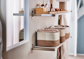 Floating wall shelves holding two-tone woven storage baskets and bamboo organizers.