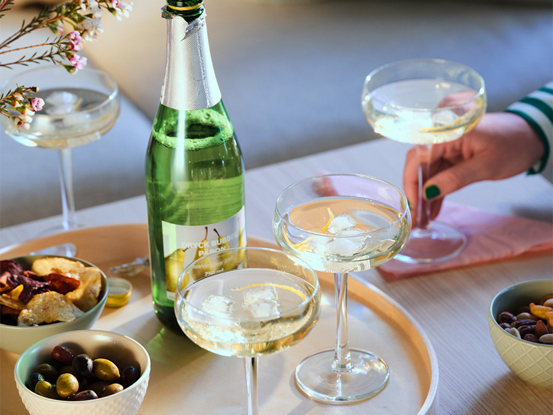 Filled glasses and snacks prepared for a toast.