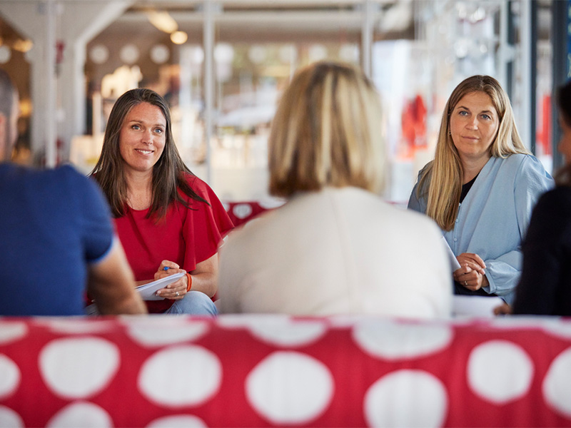 Group of people participating in a discussion meeting.